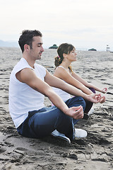 Image showing couple yoga beach