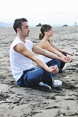 Image showing couple yoga beach