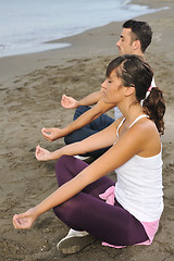 Image showing couple yoga beach