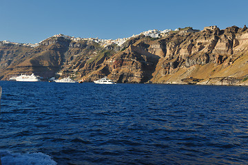 Image showing santorini island coast with luxury yacht