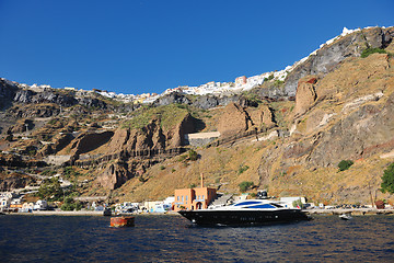 Image showing santorini island coast with luxury yacht