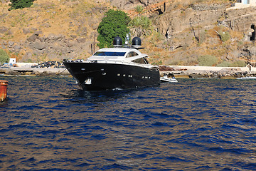 Image showing santorini island coast with luxury yacht