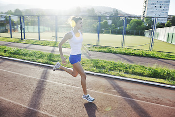 Image showing woman jogging at early morning 