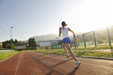 Image showing woman jogging at early morning 