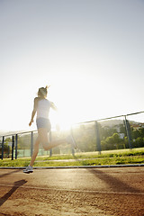 Image showing woman jogging at early morning