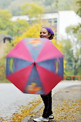 Image showing happy girl with umbrella