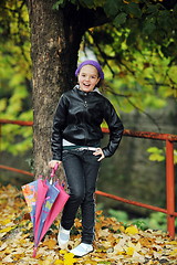 Image showing happy girl with umbrella