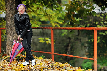 Image showing happy girl with umbrella