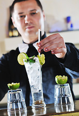 Image showing pro barman prepare coctail drink on party