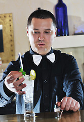 Image showing pro barman prepare coctail drink on party