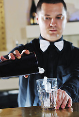 Image showing pro barman prepare coctail drink on party