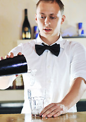 Image showing pro barman prepare coctail drink on party