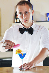 Image showing pro barman prepare coctail drink on party