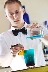 Image showing pro barman prepare coctail drink on party