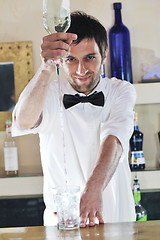 Image showing pro barman prepare coctail drink on party