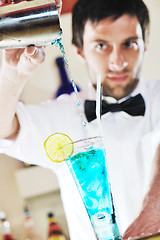 Image showing pro barman prepare coctail drink on party