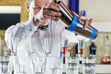 Image showing pro barman prepare coctail drink on party