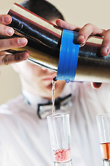 Image showing pro barman prepare coctail drink on party