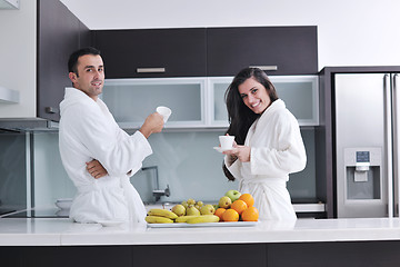 Image showing young couple have fun in modern kitchen