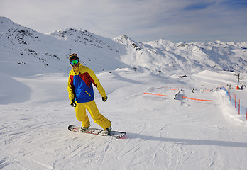 Image showing happy young man have fun at winter on mountain peak