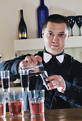 Image showing pro barman prepare coctail drink on party