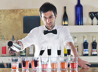 Image showing pro barman prepare coctail drink on party