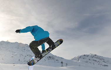 Image showing snowboarder extreme jump