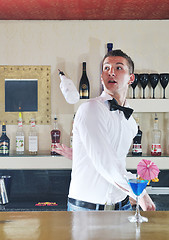 Image showing pro barman prepare coctail drink on party