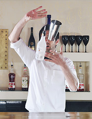 Image showing pro barman prepare coctail drink on party