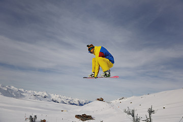 Image showing snowboarder extreme jump