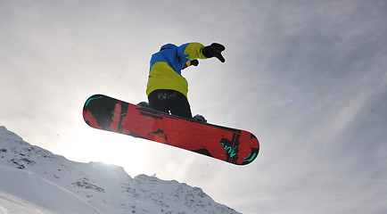 Image showing snowboarder extreme jump