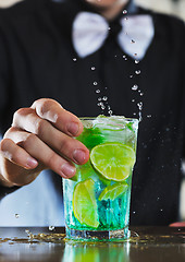 Image showing pro barman prepare coctail drink on party