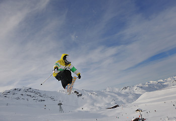 Image showing happy young man have fun at winter on mountain peak