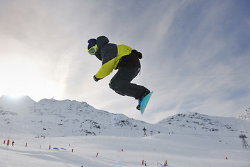 Image showing happy young man have fun at winter on mountain peak