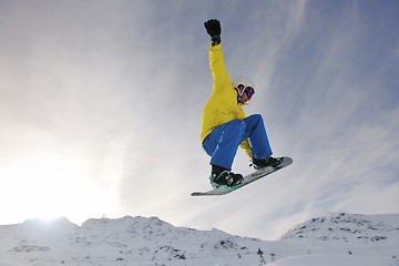 Image showing happy young man have fun at winter on mountain peak