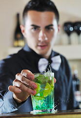 Image showing pro barman prepare coctail drink on party