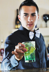 Image showing pro barman prepare coctail drink on party