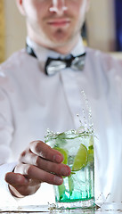 Image showing pro barman prepare coctail drink on party