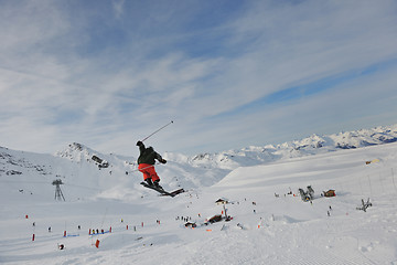 Image showing happy young man have fun at winter on mountain peak