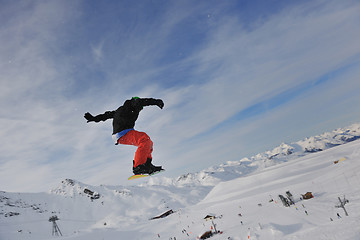 Image showing happy young man have fun at winter on mountain peak