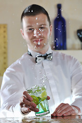 Image showing pro barman prepare coctail drink on party