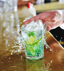 Image showing pro barman prepare coctail drink on party