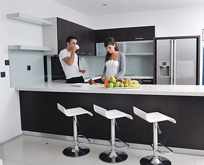 Image showing young couple have fun in modern kitchen