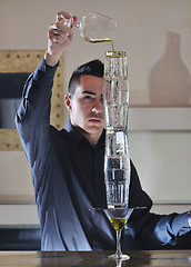 Image showing pro barman prepare coctail drink on party