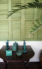 Image showing Green pottery on a table