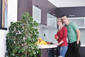 Image showing young couple have fun in modern kitchen