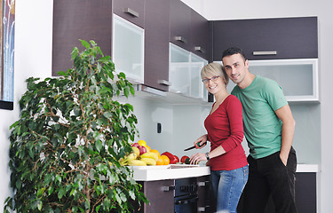 Image showing young couple have fun in modern kitchen