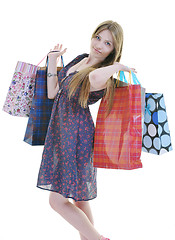 Image showing happy young adult women  shopping with colored bags