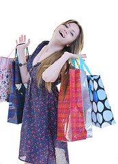 Image showing happy young adult women  shopping with colored bags