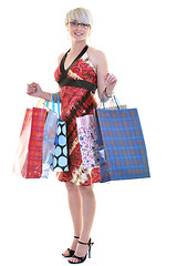 Image showing happy young adult women  shopping with colored bags